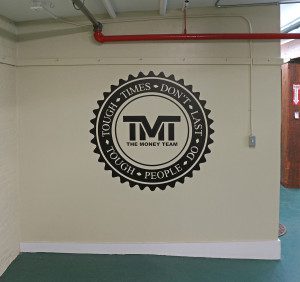 The Money Team Logo in Warehouse